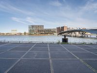 there is a large parking lot by the water and buildings at the waterfront park in downtown boston