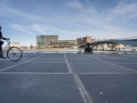 there is a large parking lot by the water and buildings at the waterfront park in downtown boston