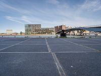 there is a large parking lot by the water and buildings at the waterfront park in downtown boston