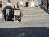 Charming Village Cafe in Tuscany: Under the Hard Shadow