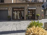 an outside view of a store called the store of piecelno on the cobblestones