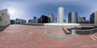 a skateboarder makes his way up the ramp in a virtual landscape of a city