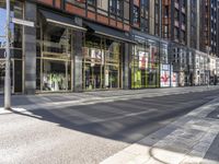 an empty street has a sign on the corner saying go out of business and walk home