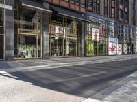 an empty street has a sign on the corner saying go out of business and walk home