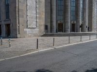 an entrance of a building with large columns and doors that spell out the word voltege