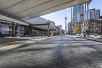people walk down a walkway in downtown toronto, ontario, canada on a bright sunny day