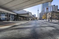 people walk down a walkway in downtown toronto, ontario, canada on a bright sunny day