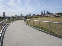 a walkway with two bikes going through it near the water and a dock on a pier