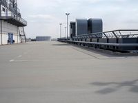 a boat is parked in an empty parking lot near an air port on the water