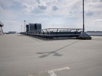 a boat is parked in an empty parking lot near an air port on the water