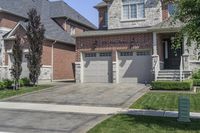 a driveway leading to the front door and driveway is well maintained with stone pavers