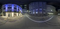 a street view with buildings, and an empty road at night with long exposurers