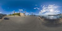 a wide angle view of a fish eye lens shot of an intersection in a city