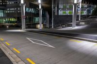 the empty empty roadway is painted yellow and has graffiti in it while parked cars are on the street