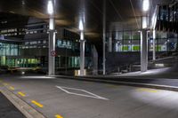 the empty empty roadway is painted yellow and has graffiti in it while parked cars are on the street