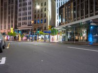 a bus in the middle of an empty city road at night, with no lights