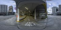 the reflection of the street that is underneath a building in a 360 - eye view panoramic image