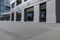 there is a skateboard that is on the side of the road in front of some buildings