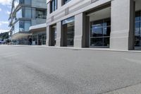there is a skateboard that is on the side of the road in front of some buildings