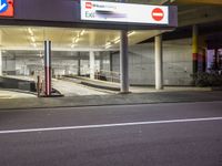 a bus drives past a parking garage at night time or night time in the city