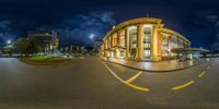 a fisheye view of a street with an empty parking space in the foreground