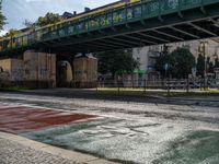 Wet Asphalt Streets Under Berlin's Bridges