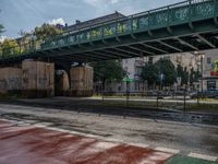 Wet Asphalt Streets Under Berlin's Bridges