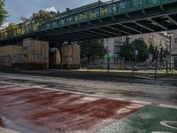 Wet Asphalt Streets Under Berlin's Bridges