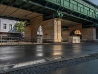 Wet Asphalt Roads Amidst Berlin's Urban Design