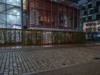 Wet Cobblestone Road in Berlin at Night