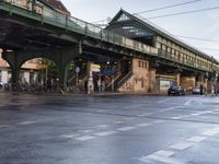 the view under the highway, on a rainy day of the city street and on the streets with buildings and bicycles