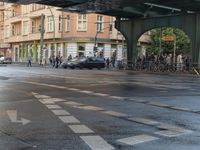 the view under the highway, on a rainy day of the city street and on the streets with buildings and bicycles