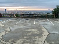 the asphalt parking lot in a city is dirty and ready for the parking area to be opened