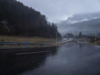 Wet Road: Asphalt and Rain in a Mountain Pass