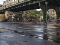 the view under the highway, on a rainy day of the city street and on the streets with buildings and bicycles