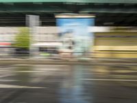 traffic is passing in a blurry view on a busy intersection on a city street