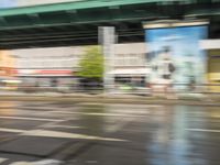 traffic is passing in a blurry view on a busy intersection on a city street