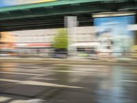 traffic is passing in a blurry view on a busy intersection on a city street