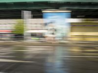 traffic is passing in a blurry view on a busy intersection on a city street