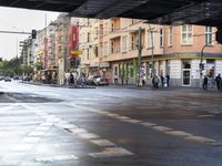 the view under the highway, on a rainy day of the city street and on the streets with buildings and bicycles