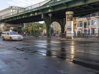 the view under the highway, on a rainy day of the city street and on the streets with buildings and bicycles