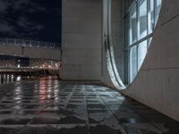 Wet Urban Road Under Artificial Light in Berlin