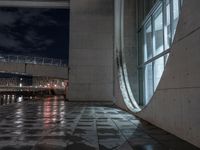 Wet Urban Road Under Artificial Light in Berlin