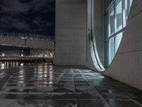 Wet Urban Road Under Artificial Light in Berlin