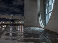 Wet Urban Road Under Artificial Light in Berlin