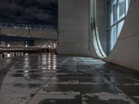 Wet Urban Road Under Artificial Light in Berlin