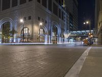 a car turning a corner at night with long exposure of city lights coming off it