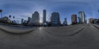 this is the fish eye view of a very wide cityscape seen in this lens