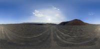 the view of a very wide desert on a sunny day with no clouds in sight