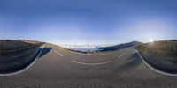 a fish eye lens view of a winding road in the mountains, taken using the teli camera